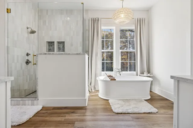 a front view of a house with a yard and lake view