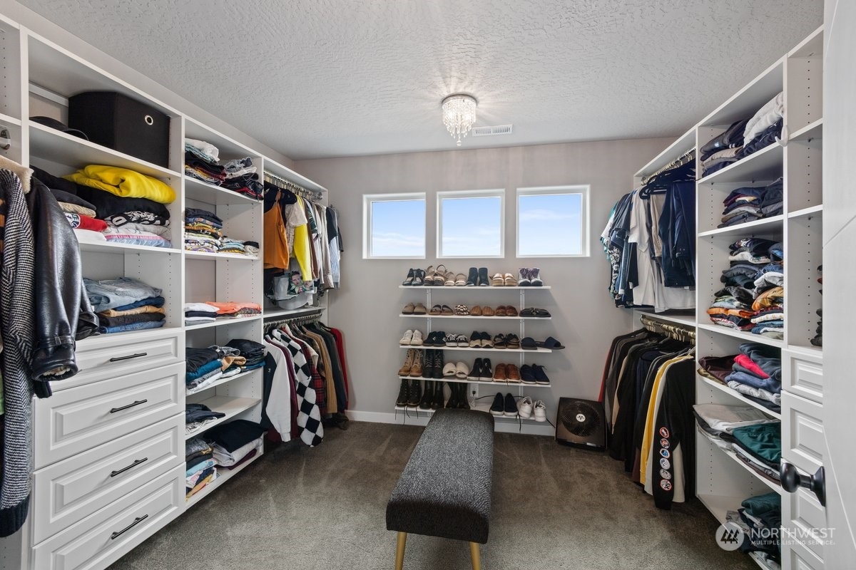 1835 Hood River Road Liberty Lake, WA 99016 - Photo 17 of 37 a view of walk in closet with clothes and shoes