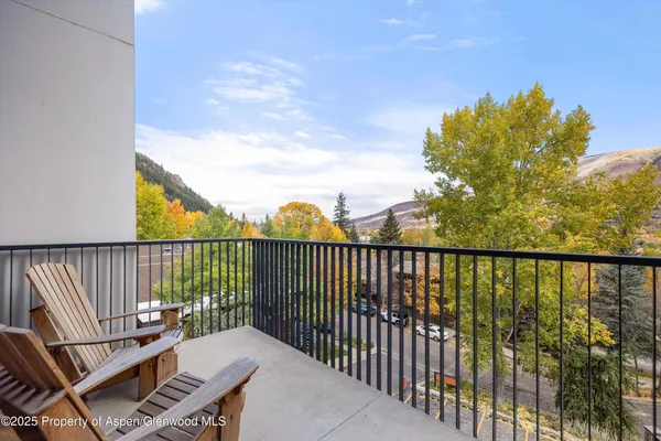 a view of a balcony with wooden floor
