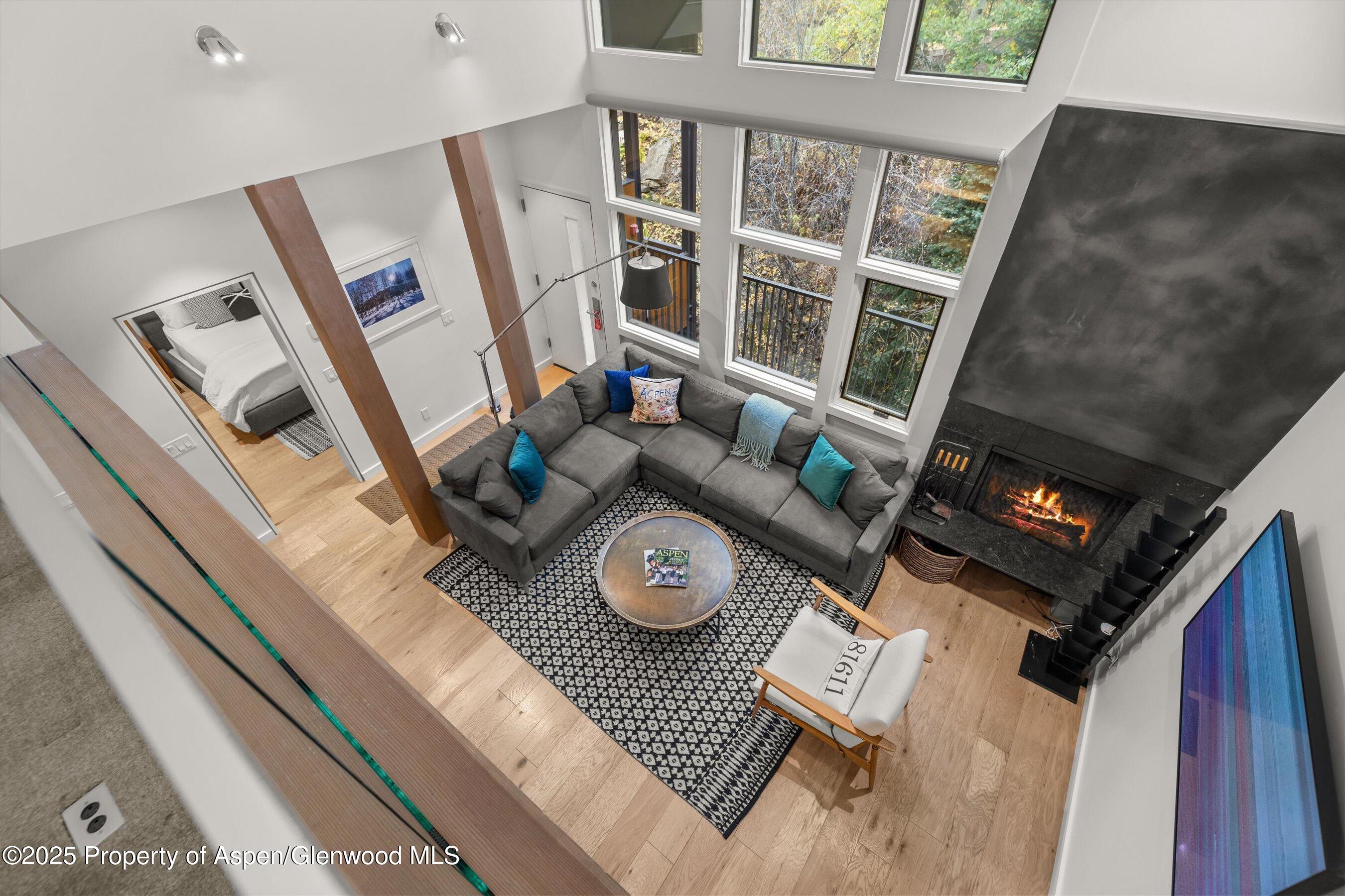 800 South Mill Street, Unit 303C Aspen, CO 81611 - Photo 28 of 32 a view of living room with furniture and a floor to ceiling window