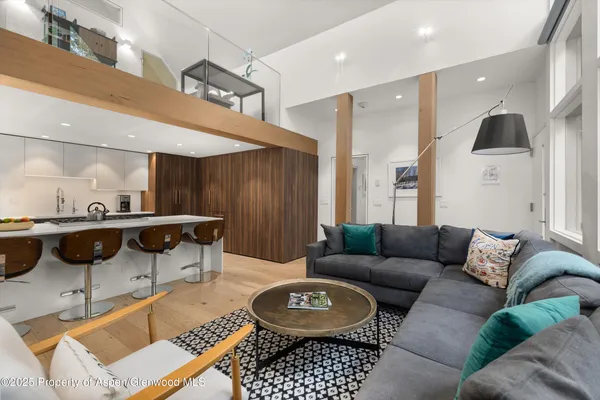 a living room with furniture and a rug