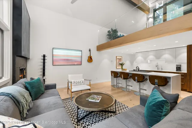 a living room with furniture and a table