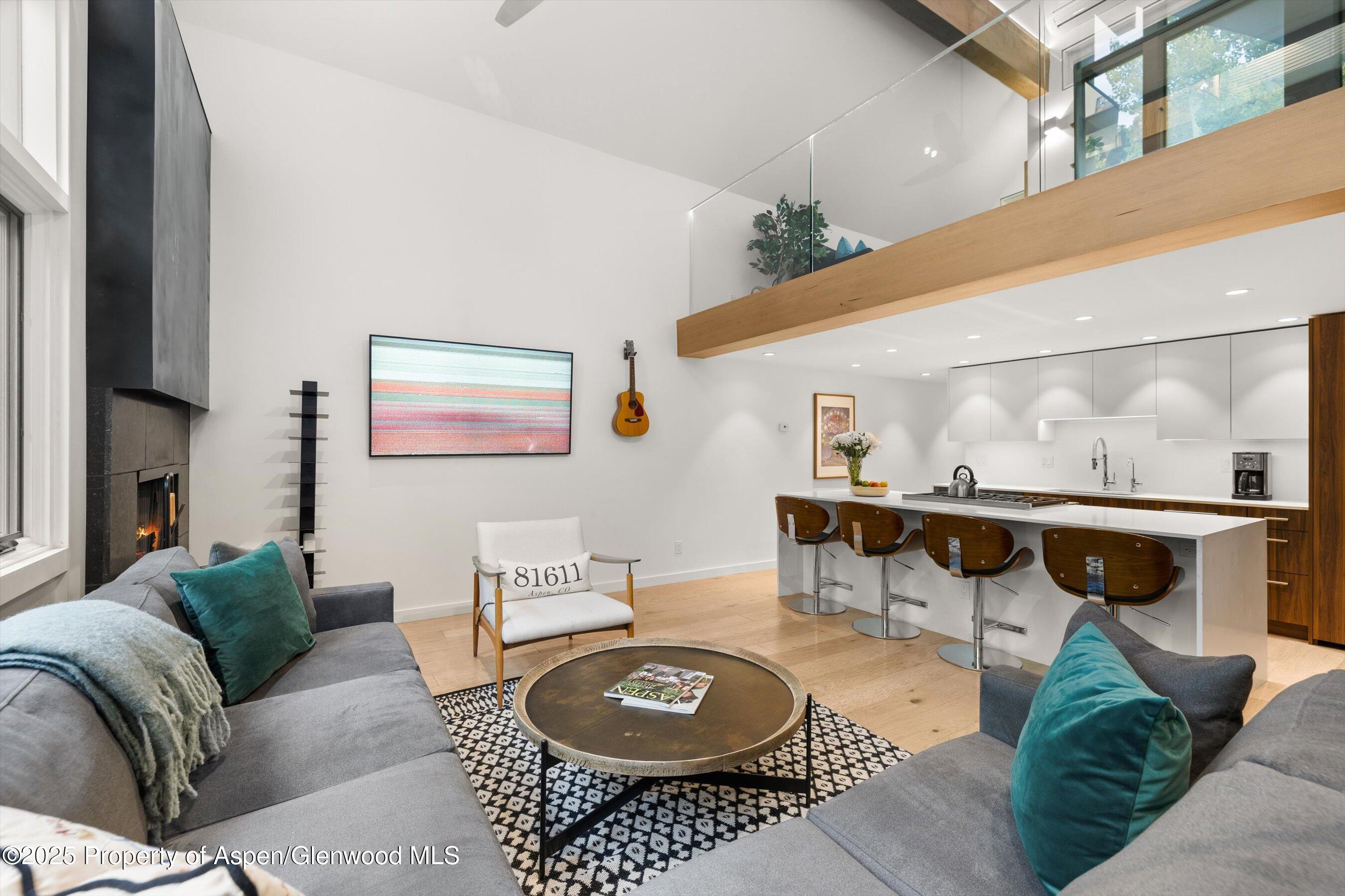 800 South Mill Street, Unit 303C Aspen, CO 81611 - Photo 6 of 32 a living room with furniture and a table