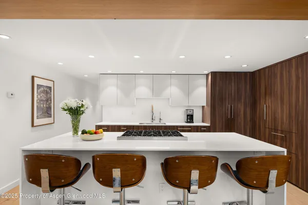 a kitchen with a table and chairs in it