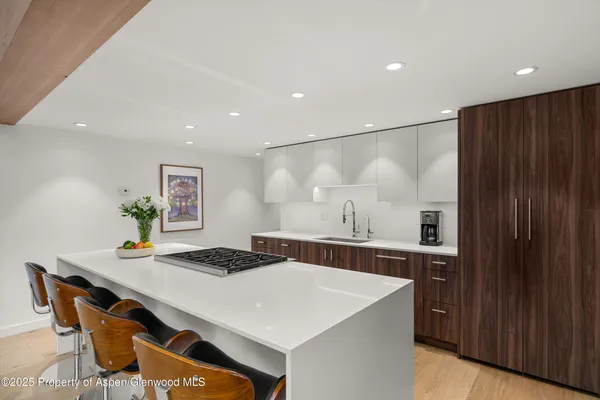 a view of a dining table and chairs in a room