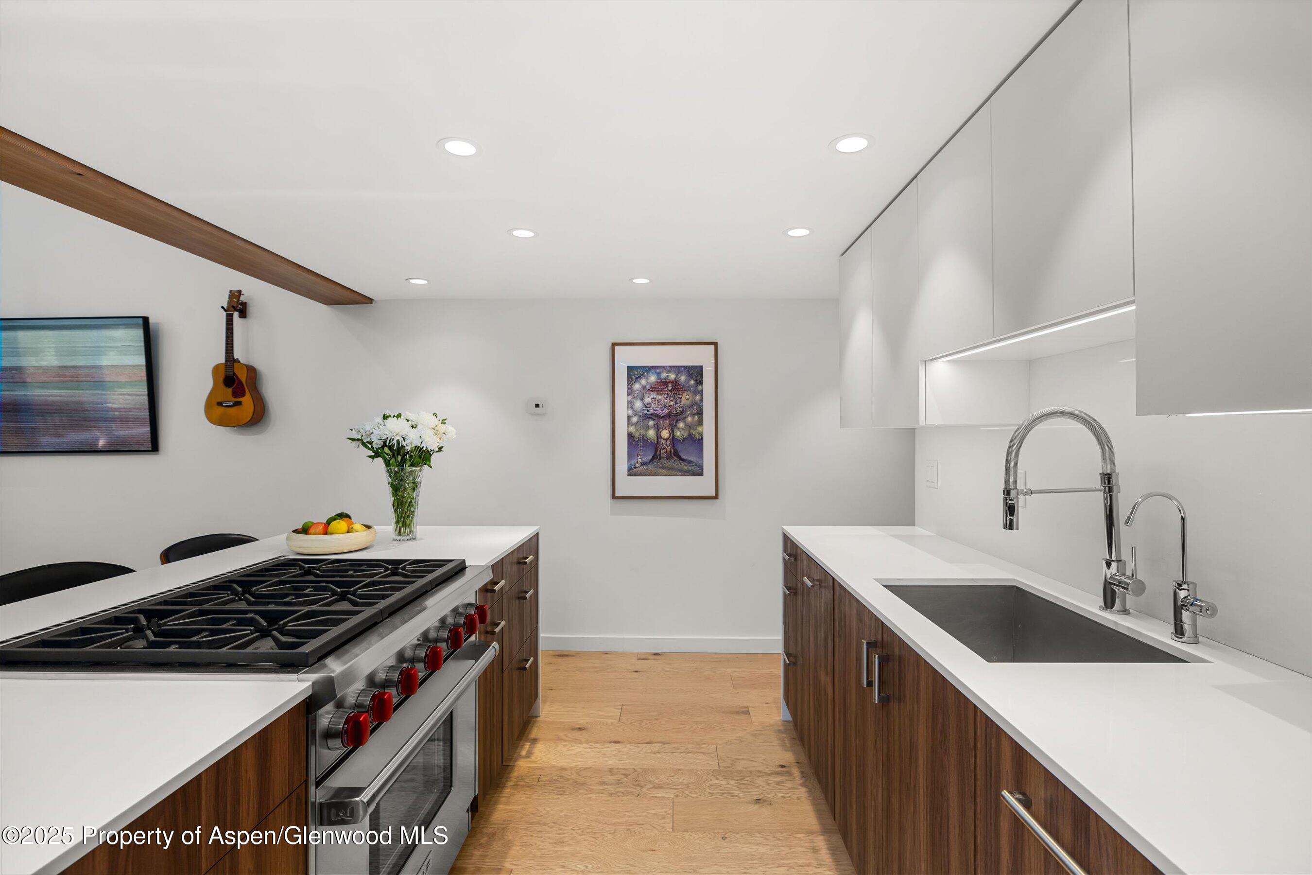 800 South Mill Street, Unit 303C Aspen, CO 81611 - Photo 9 of 32 a kitchen that has a sink and a stove