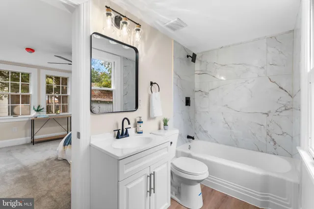 a bathroom with a toilet sink and bathtub