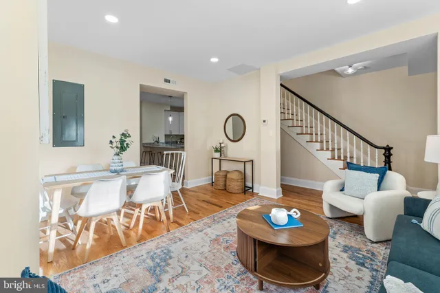 a living room with furniture and a table
