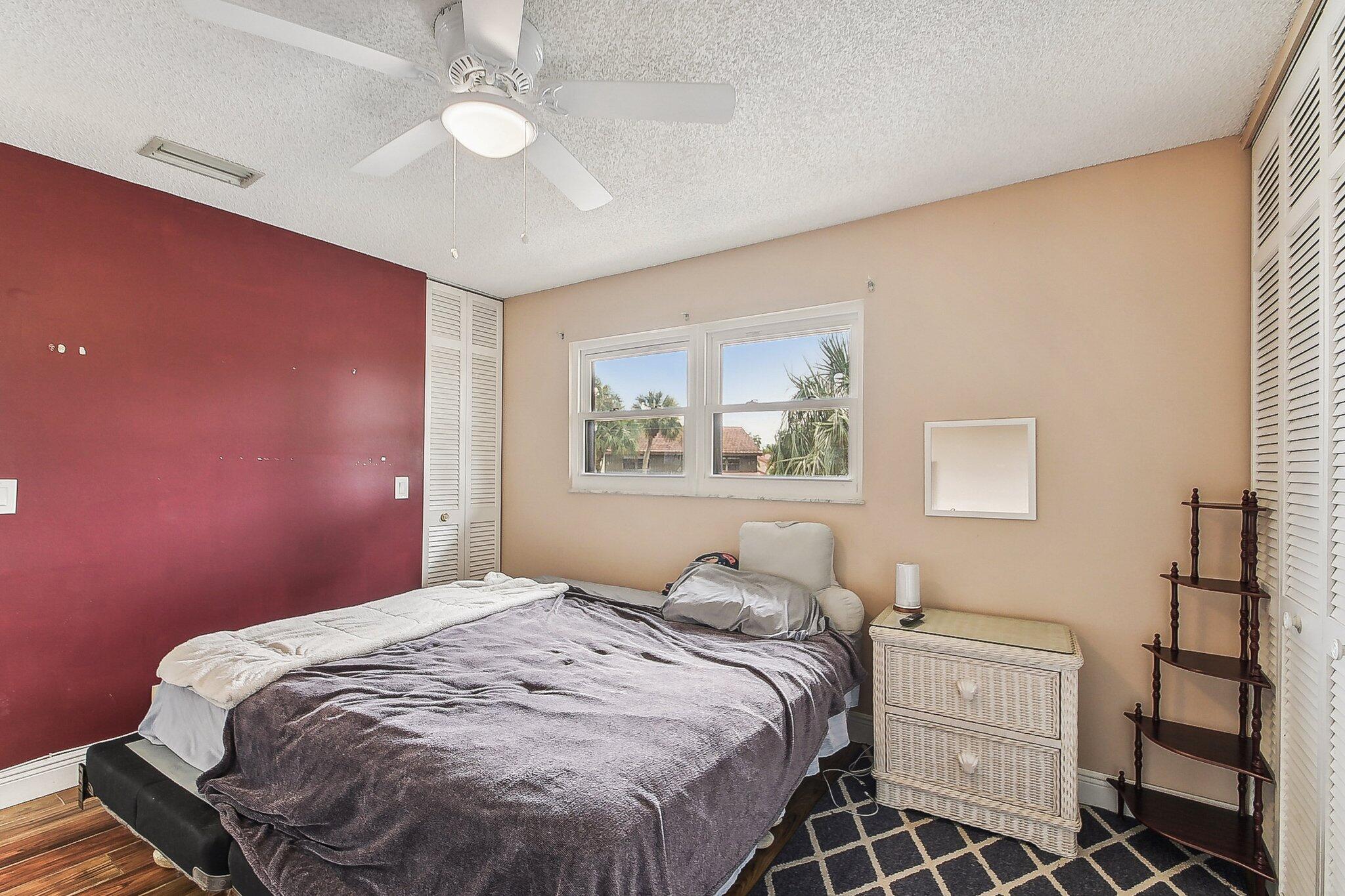 11063 Oakdale Road Boynton Beach, FL 33437 - Photo 37 of 65 a bedroom with a bed and a window