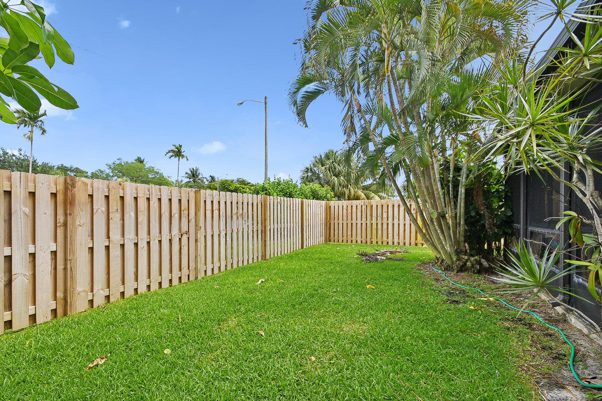 11063 Oakdale Road Boynton Beach, FL 33437 - Photo 44 of 65 a view of a backyard with a trees