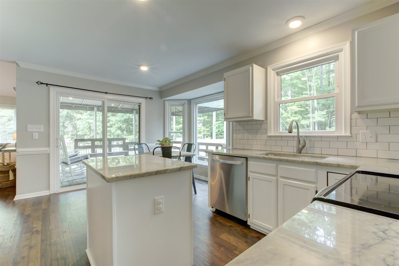 5516 Banwell Place Raleigh, NC 27613 - Photo 7 of 30 Gorgeous remodeled kitchen with new quartzite countertops Kitchen