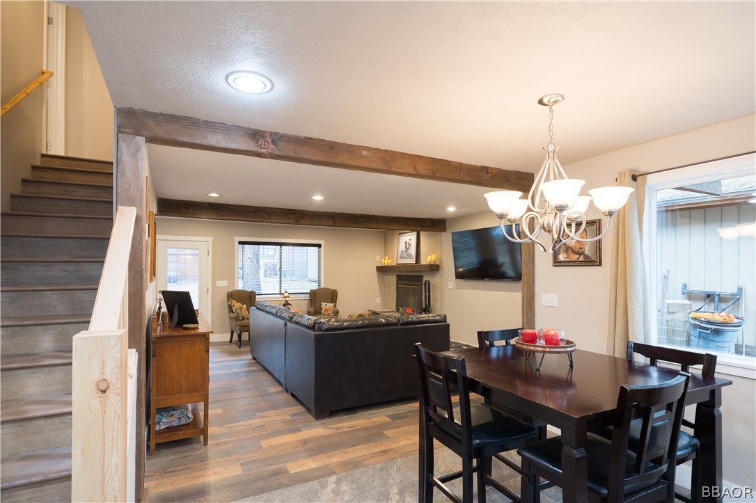 270 Spruce Lane Sugarloaf, CA 92386 - Photo 13 of 39 a view of a dining room with furniture and chandelier