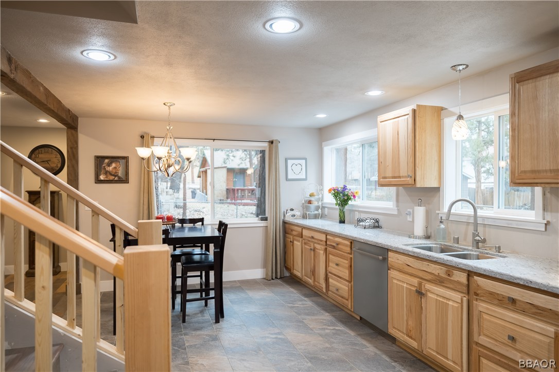 270 Spruce Lane Sugarloaf, CA 92386 - Photo 16 of 39 a kitchen with stainless steel appliances granite countertop a sink and cabinets