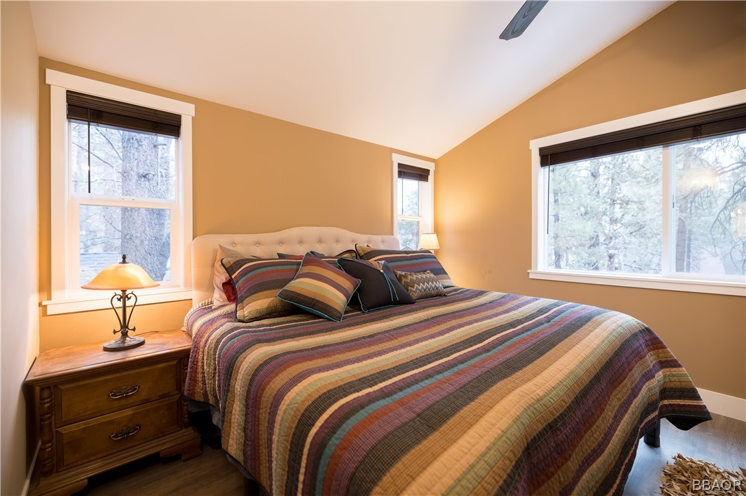 270 Spruce Lane Sugarloaf, CA 92386 - Photo 20 of 39 a bedroom with a bed and a night stand