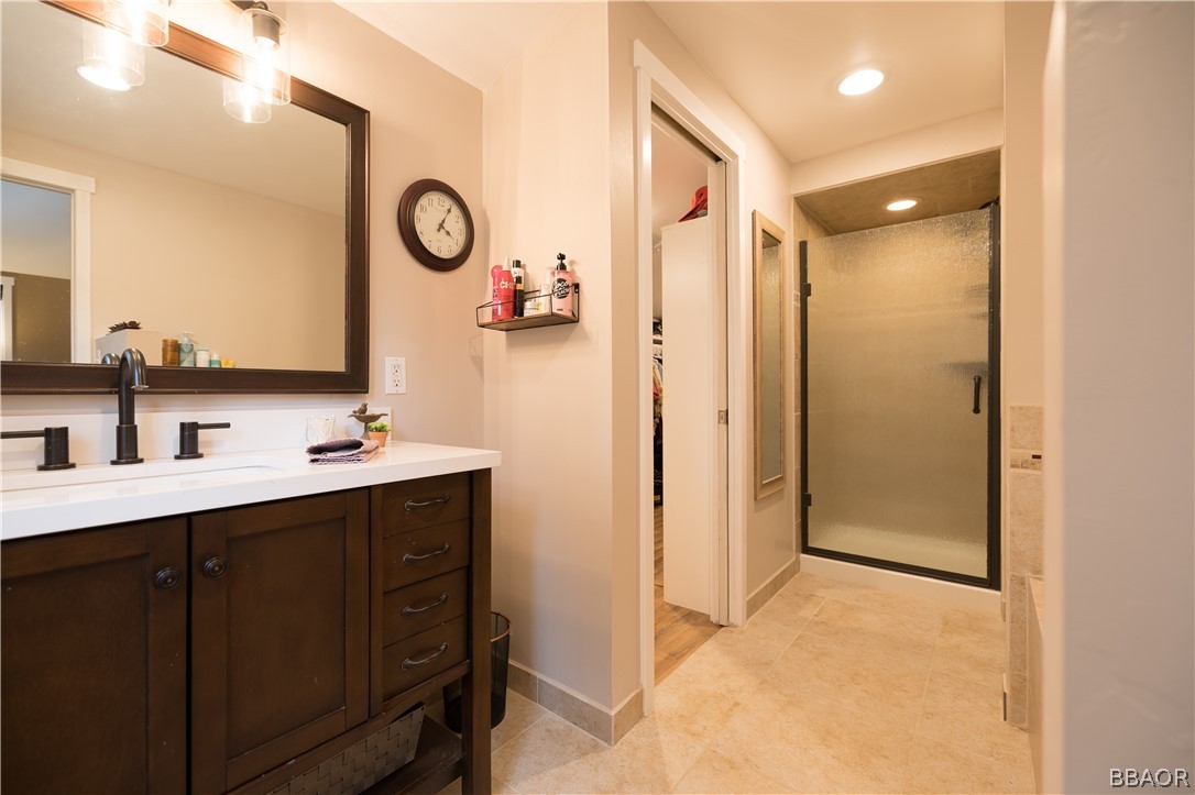 270 Spruce Lane Sugarloaf, CA 92386 - Photo 22 of 39 a bathroom with a mirror sink and a shower