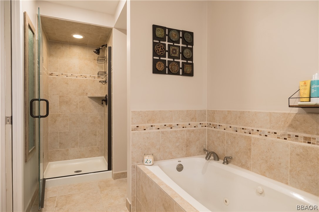 270 Spruce Lane Sugarloaf, CA 92386 - Photo 23 of 39 a bathroom with a bathtub and a shower