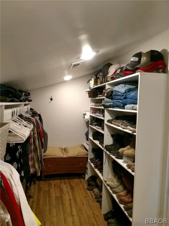 270 Spruce Lane Sugarloaf, CA 92386 - Photo 24 of 39 a view of walk in closet with clothes and shoes