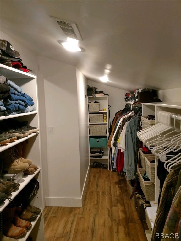 270 Spruce Lane Sugarloaf, CA 92386 - Photo 25 of 39 a view of walk in closet with clothes and shoes