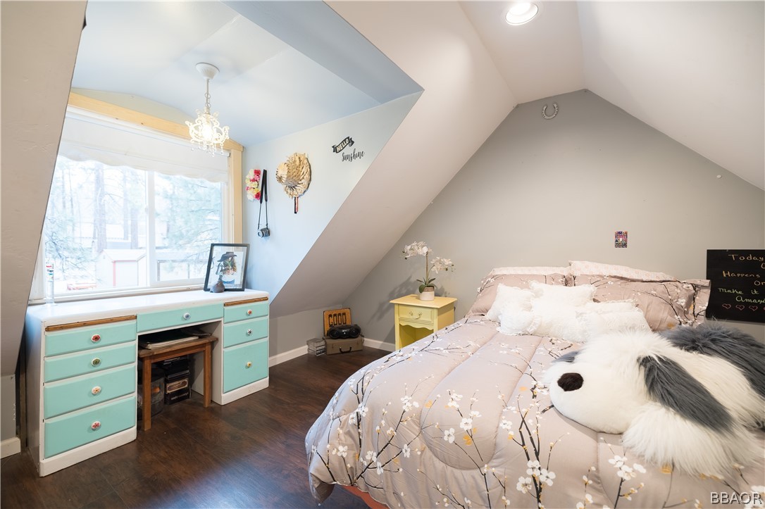 270 Spruce Lane Sugarloaf, CA 92386 - Photo 29 of 39 a bedroom with a bed and a table