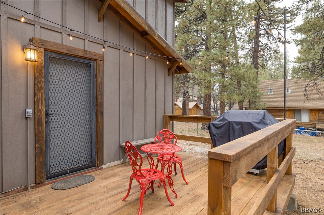 270 Spruce Lane Sugarloaf, CA 92386 - Photo 38 of 39 a backyard of a house with table and chairs