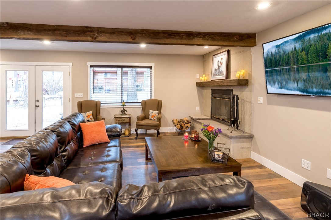 270 Spruce Lane Sugarloaf, CA 92386 - Photo 6 of 39 a living room with furniture and a fireplace