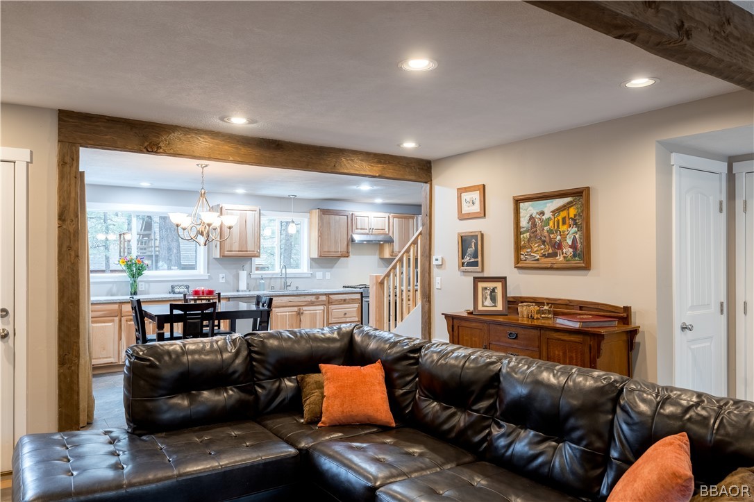 270 Spruce Lane Sugarloaf, CA 92386 - Photo 7 of 39 a living room with furniture and a flat screen tv