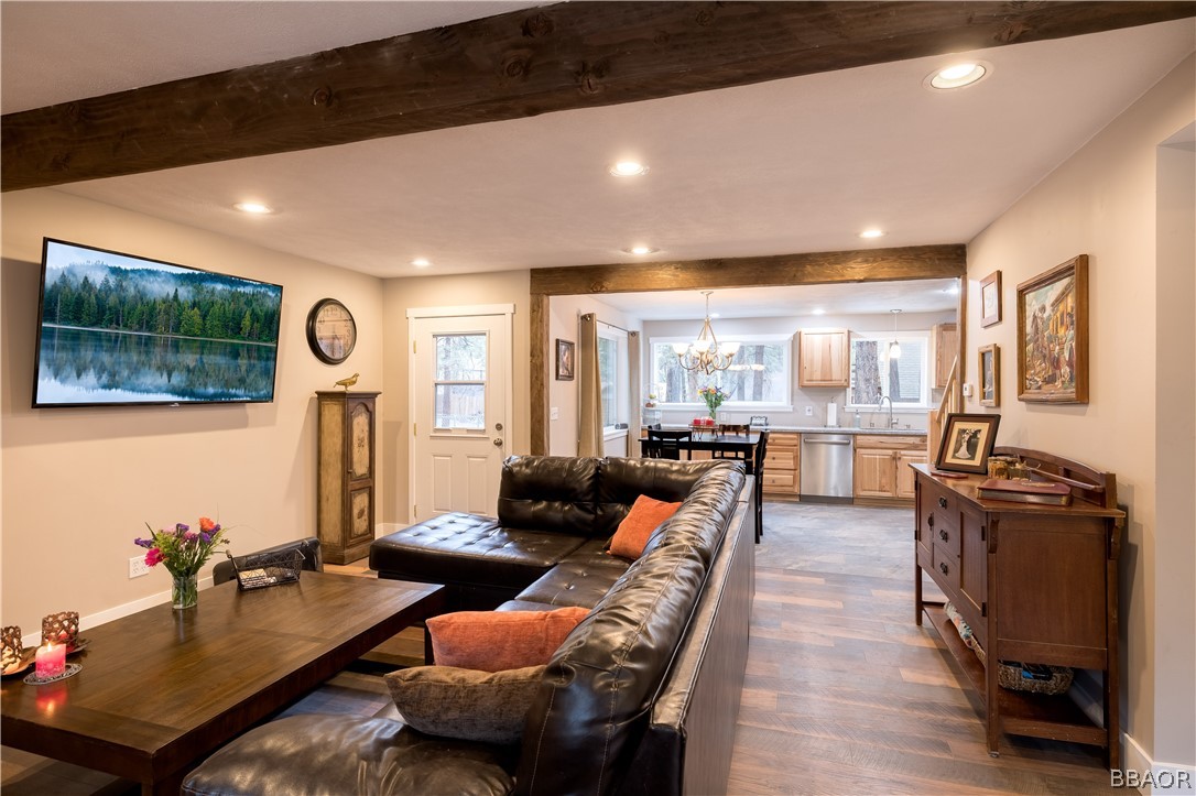 270 Spruce Lane Sugarloaf, CA 92386 - Photo 10 of 39 a living room with furniture kitchen view and a large window