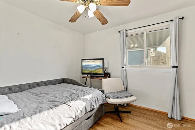 a bedroom with bed and a window