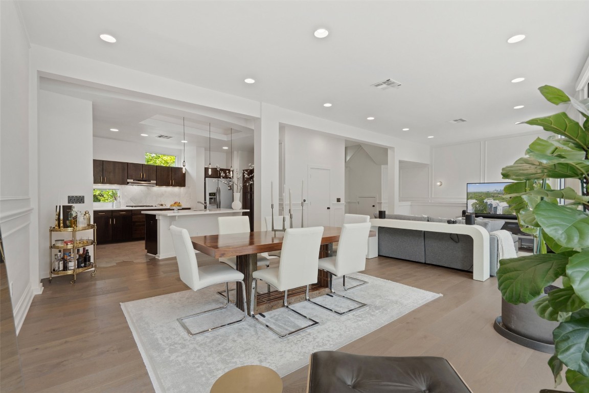 1500 Summit Street, Unit 5 Austin, TX 78741 - Photo 13 of 38 a living room with furniture and a kitchen