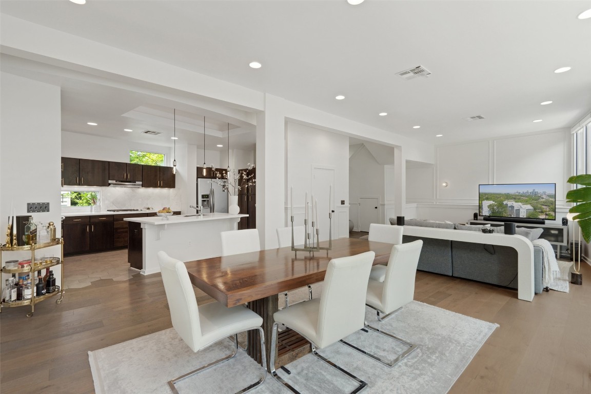 1500 Summit Street, Unit 5 Austin, TX 78741 - Photo 14 of 38 a large kitchen with a table and chairs in it