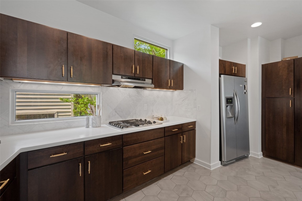 1500 Summit Street, Unit 5 Austin, TX 78741 - Photo 19 of 38 a kitchen with a sink cabinets and stainless steel appliances