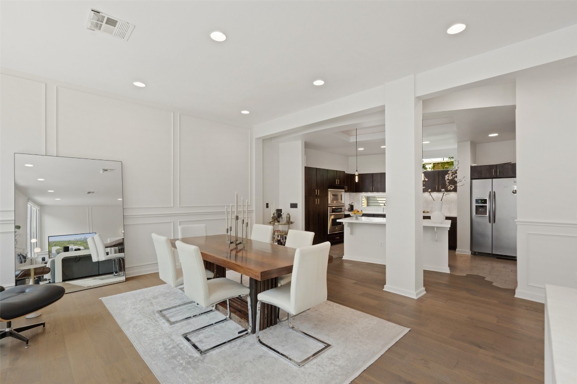 1500 Summit Street, Unit 5 Austin, TX 78741 - Photo 6 of 38 a living room with furniture a view of kitchen and a dining table