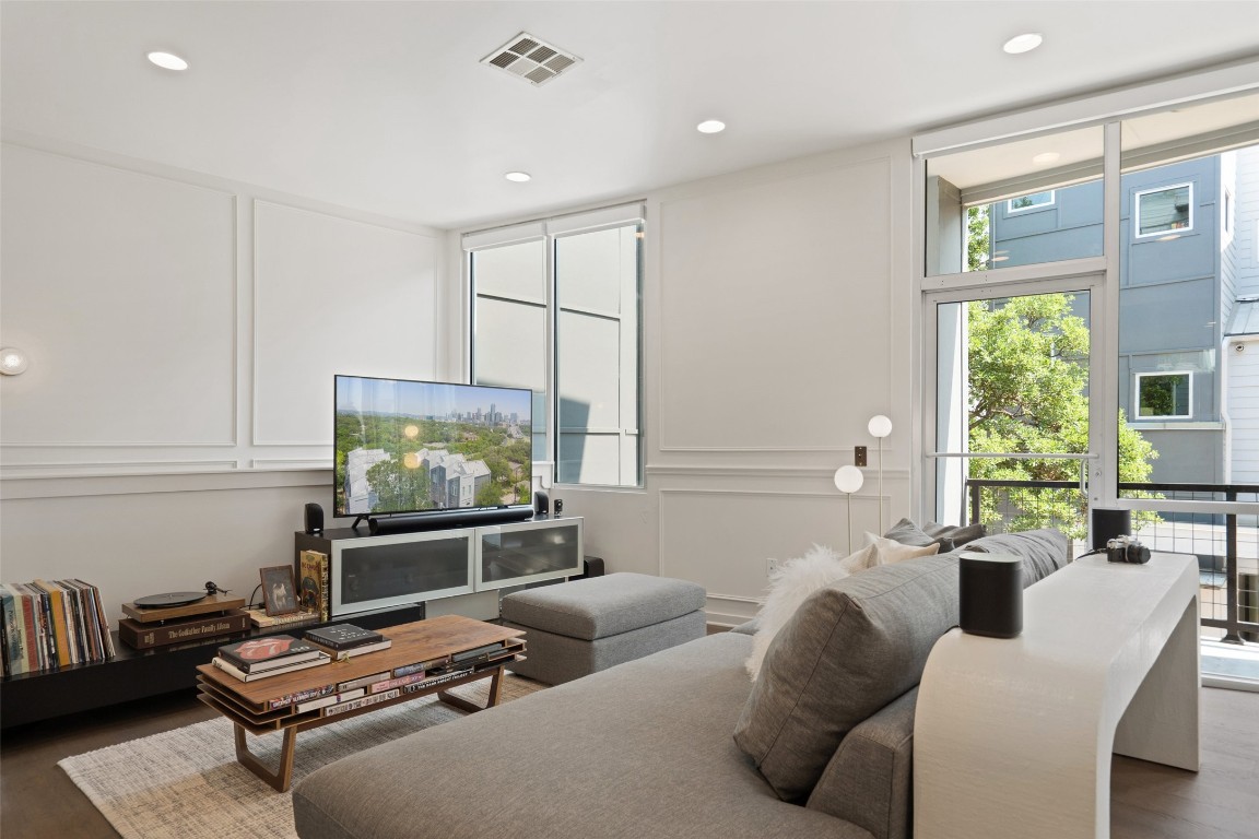 1500 Summit Street, Unit 5 Austin, TX 78741 - Photo 7 of 38 a living room with furniture and a flat screen tv