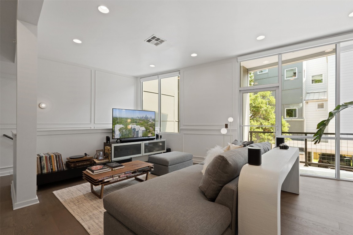 1500 Summit Street, Unit 5 Austin, TX 78741 - Photo 8 of 38 a living room with furniture a large window and flat screen tv