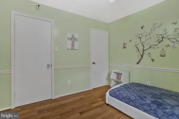 a bedroom with a bed and hallway