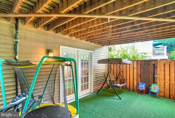 a view of a backyard with a table and a chair