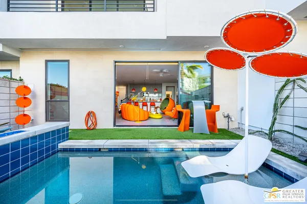 a room with chairs and pool table