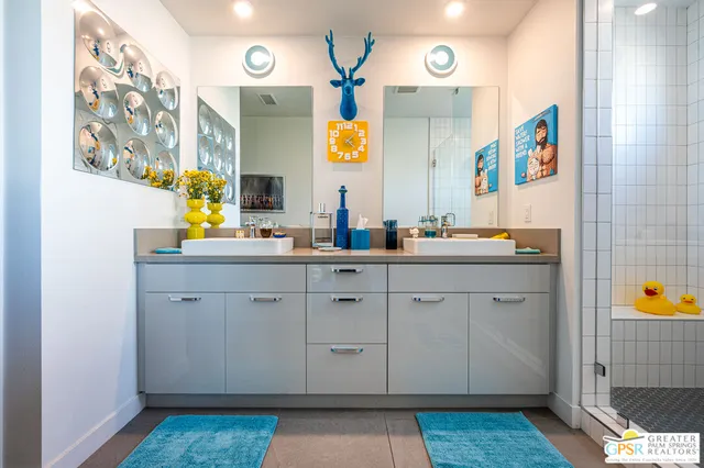 a living room with furniture and a mirror