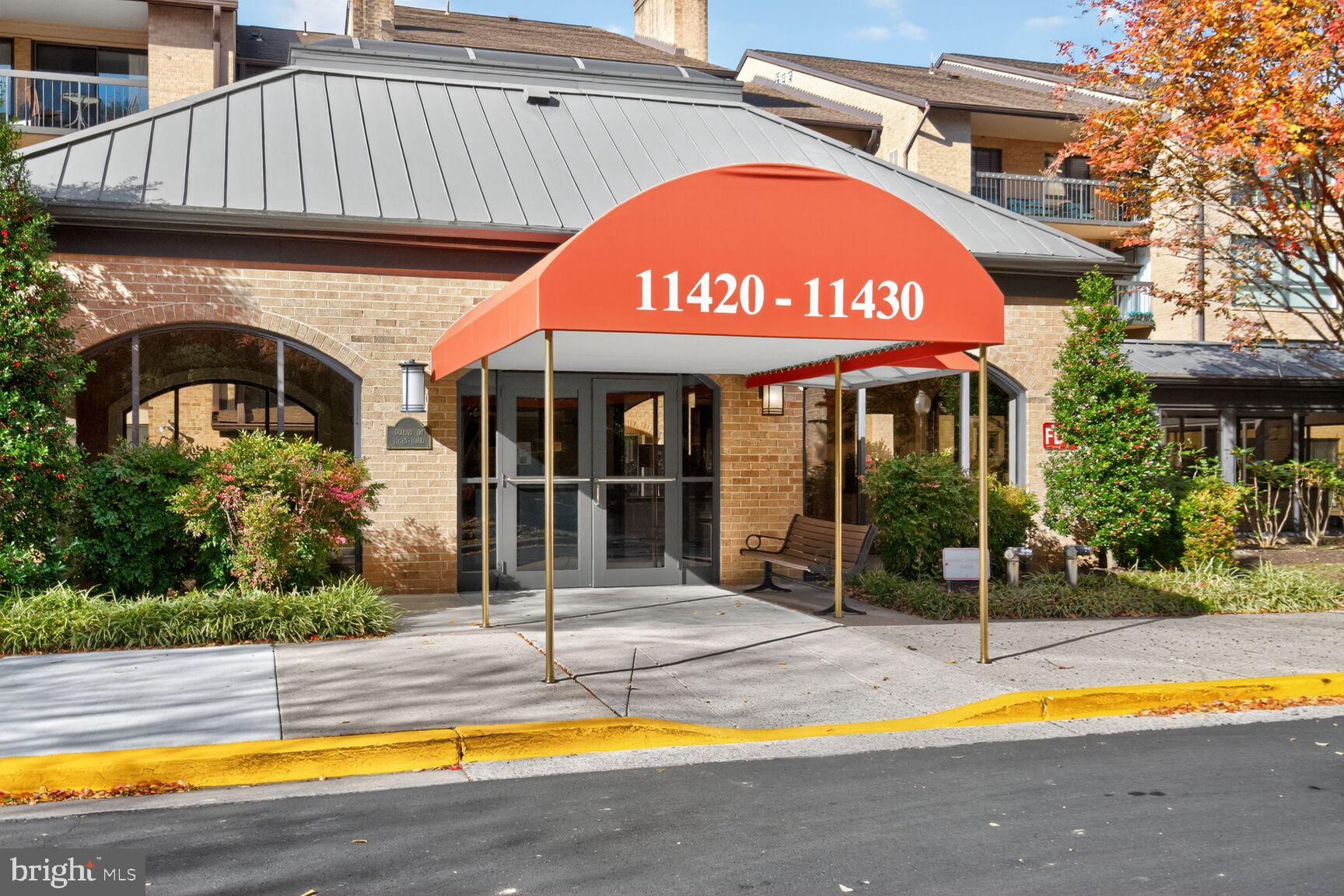 a view of an house with swimming pool and porch