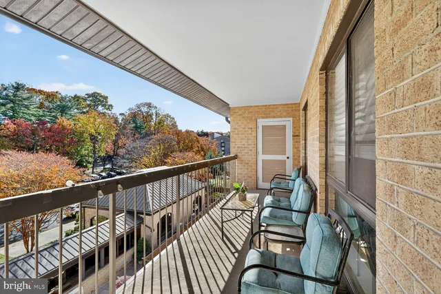 a view of balcony with furniture