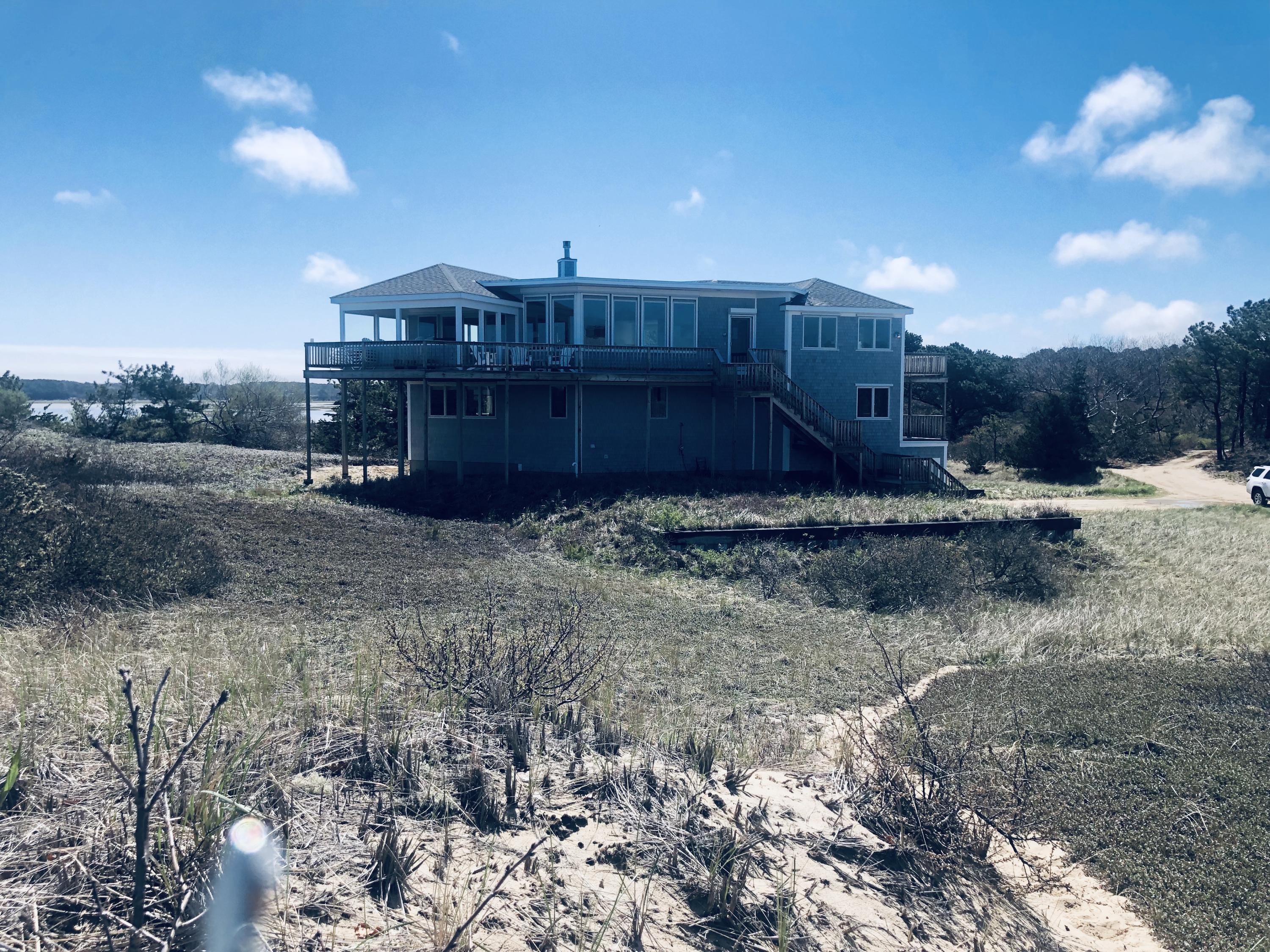 1015 3rd Avenue Wellfleet, MA 02667 - Photo 16 of 16 a view of a house with a yard