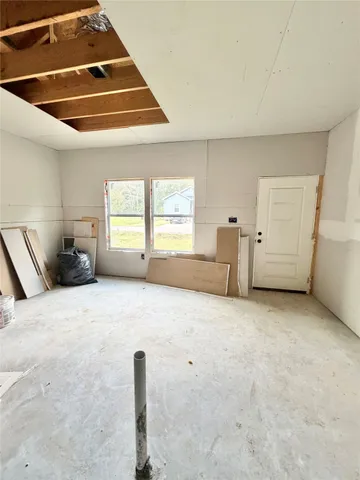 a living room with furniture and windows