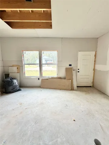 a view of a field with an trees