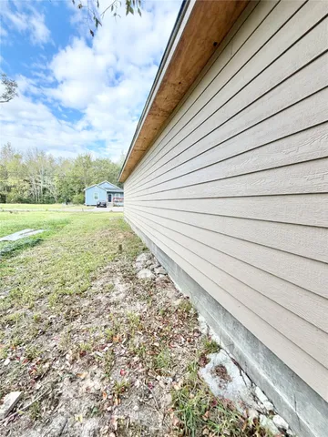 a bedroom with a bed and a chair