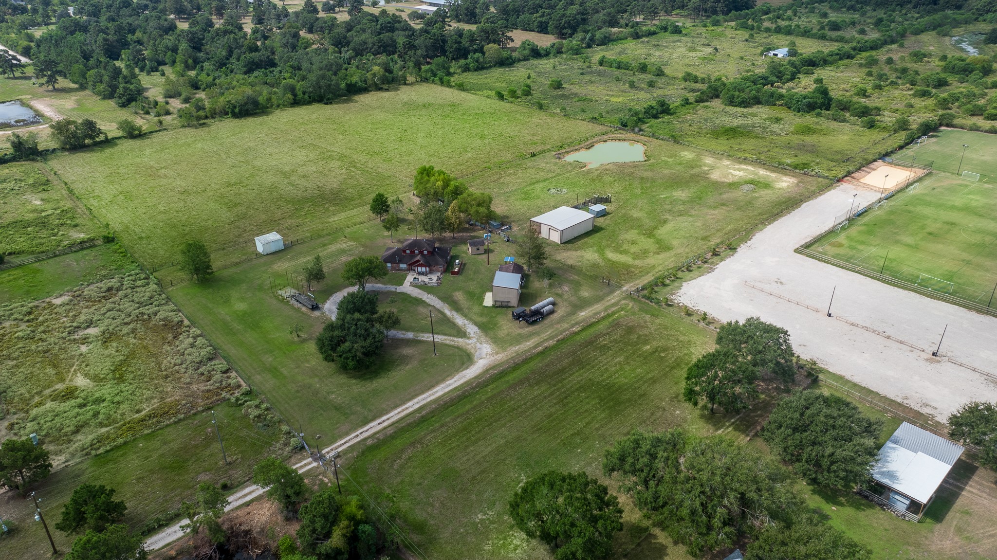 19105 Mueschke Road Tomball, TX 77377 - Photo 11 of 16 a view of a lake with huge green field
