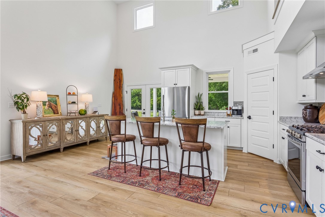 2016 Forge Road Toano, VA 23168 - Photo 54 of 99 Bright kitchen featuring white cabinetry, stainles