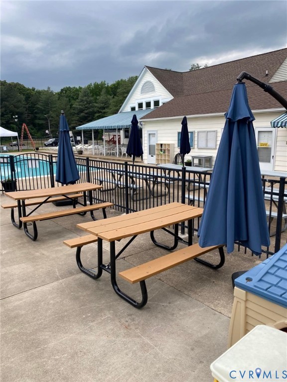 548 Glenmeadow Road Midlothian, VA 23114 - Photo 28 of 31 a view of a patio with a table and chairs