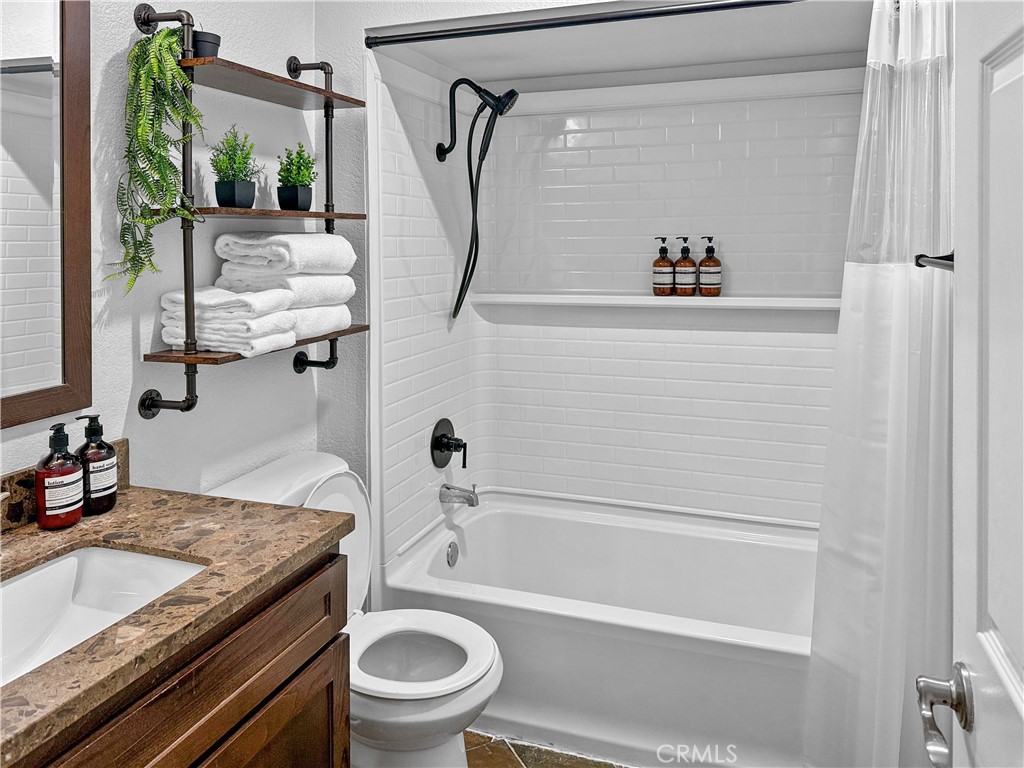 16955 Lake Knoll Parkway Riverside, CA 92503 - Photo 35 of 42 a bathroom with a granite countertop sink toilet and shower