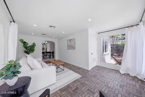 a bed room with a bed and a chair