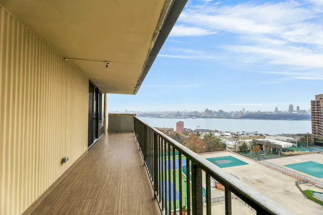 a view of a balcony with city view
